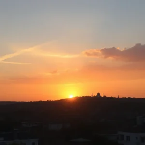 A sunset over a city representing peace and reconciliation